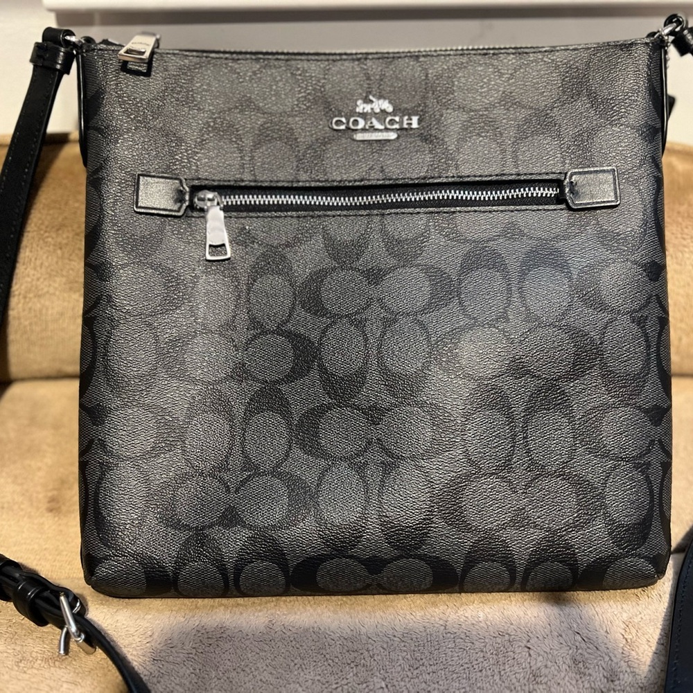 Coach Black Envelope Crossbody with silver zip closure.